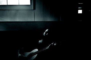 Jarred Greff with a borrowed classical guitar Jarred Greff with a borrowed classical guitar