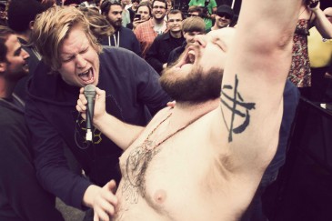 Fucked Up @ Olympic Plaza - Pink Eyes gets a belly rub by Ryan Walter Wagner